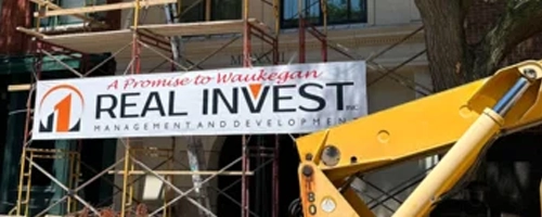 real invest sign on building